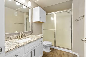 a bathroom with a toilet sink and shower at Sonterra Apartment Homes, Austin, TX, 78726